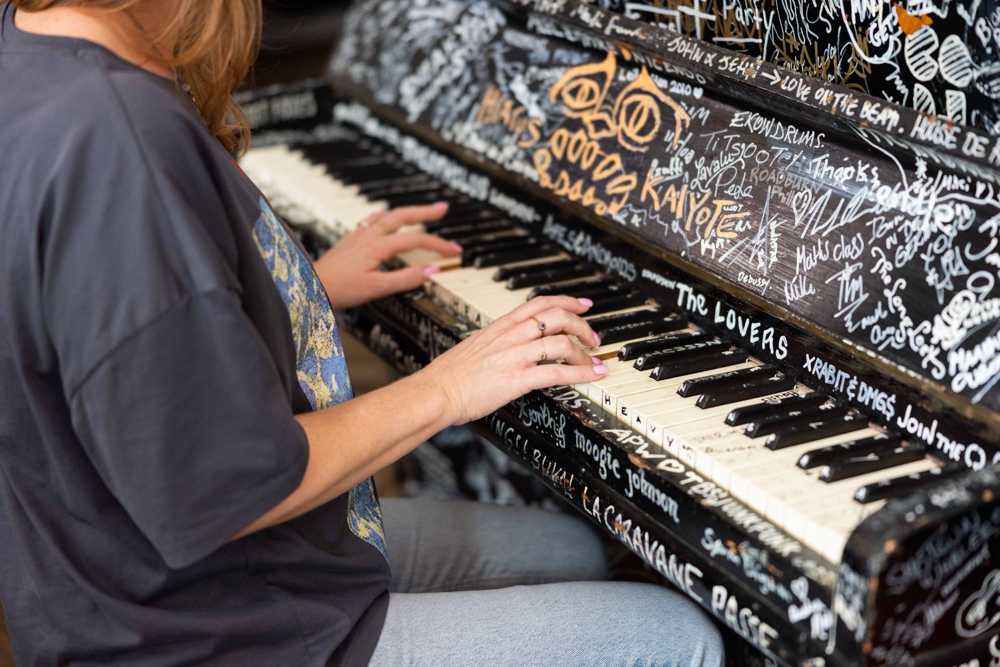 Graffiti-covered piano at the Backstage Hotel
